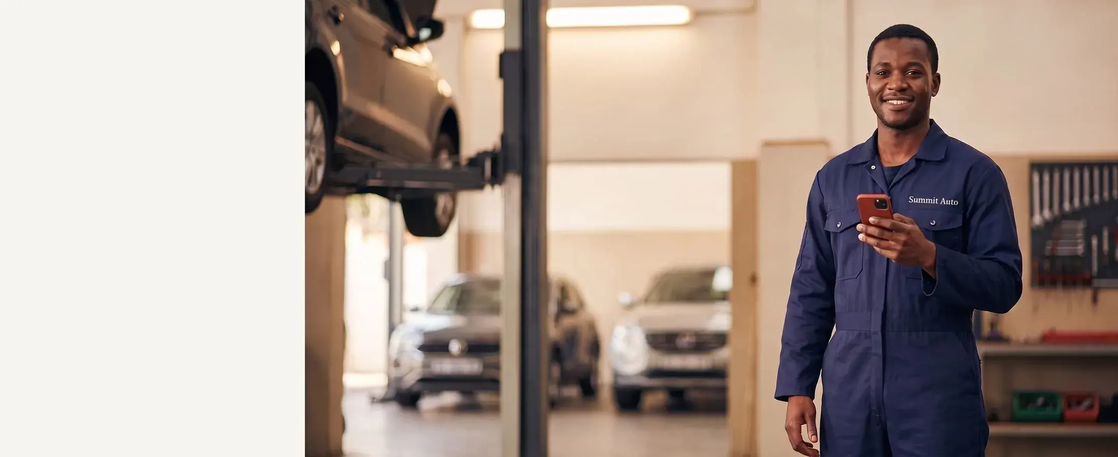 Auto repair technician inside a service garage