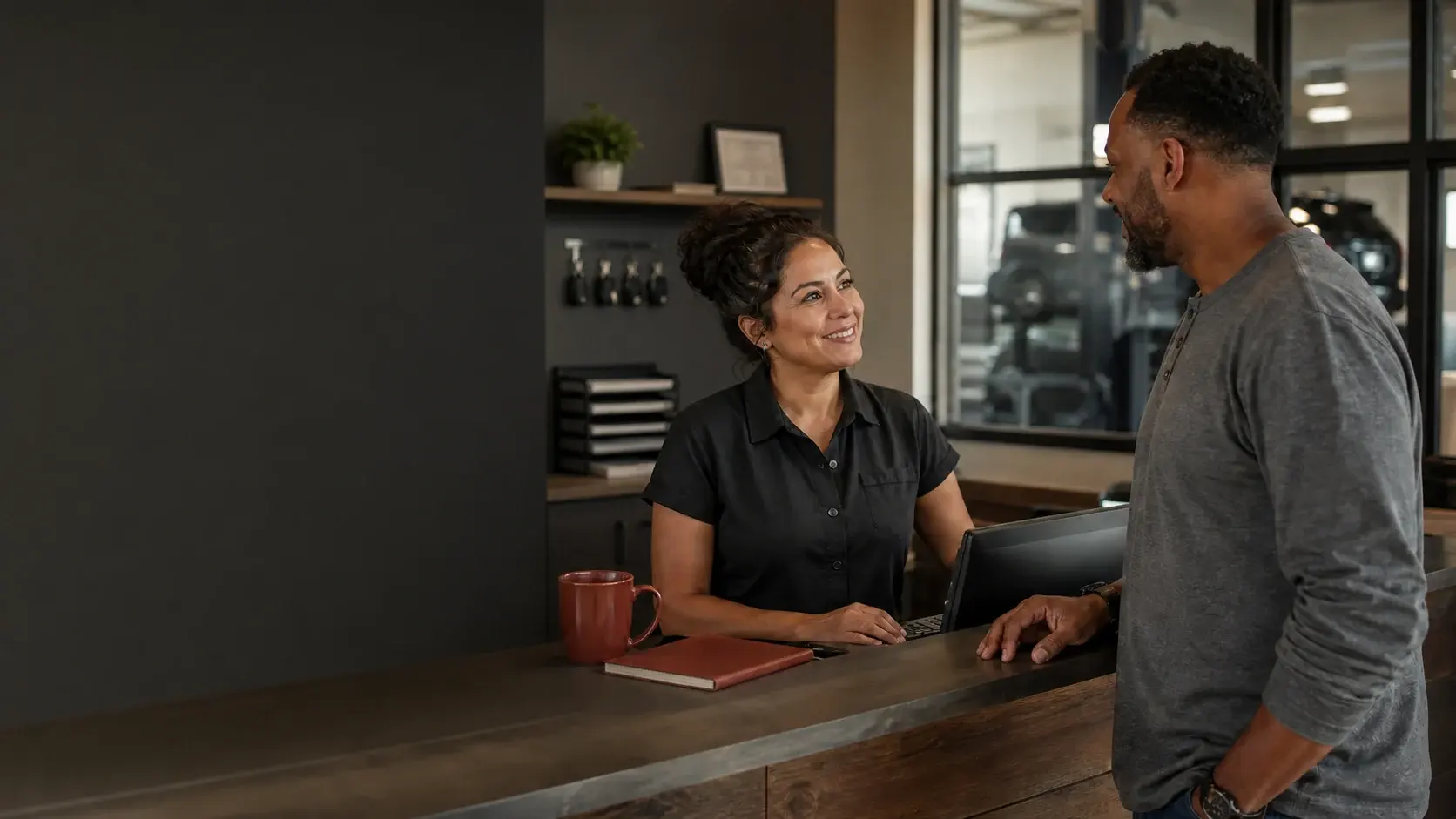 A returning customer being warmly recognized at an independent service business