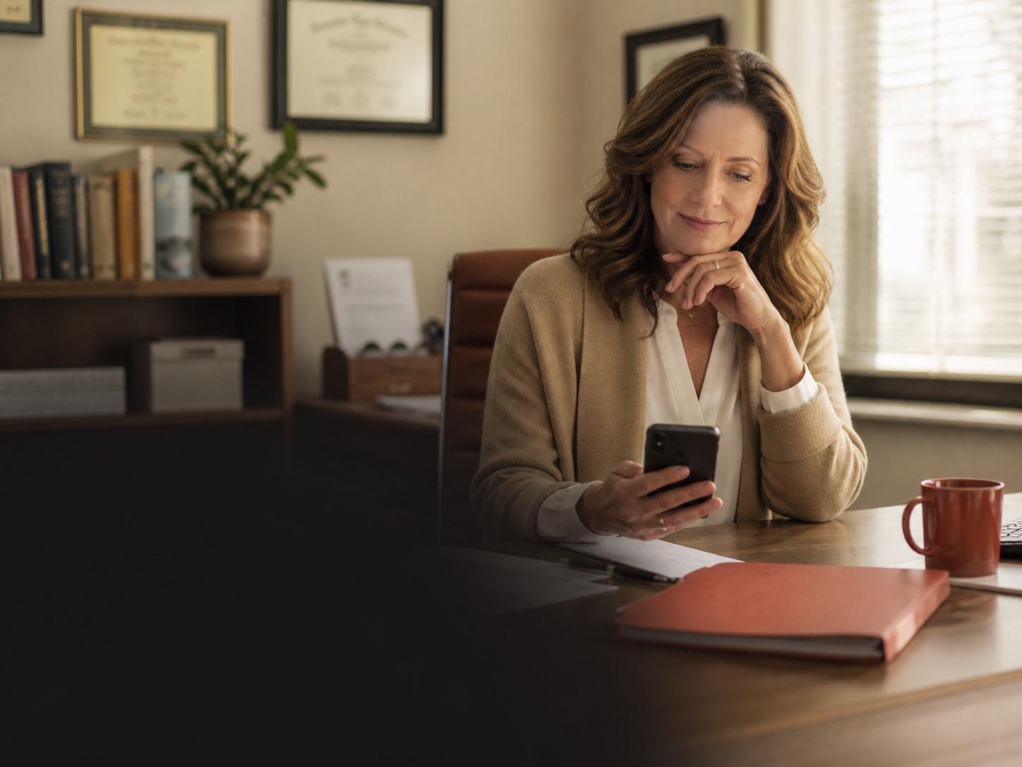 A local business owner reviewing a completed customer call on her phone